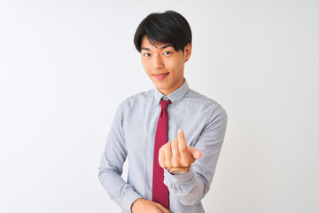 Wall Mural - Chinese businessman wearing elegant tie standing over isolated white background Beckoning come here gesture with hand inviting welcoming happy and smiling