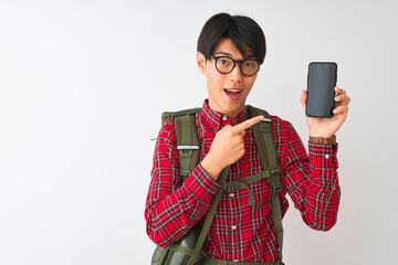 Wall Mural - Chinese hiker man wearing canteen holding smartphone over isolated white background very happy pointing with hand and finger