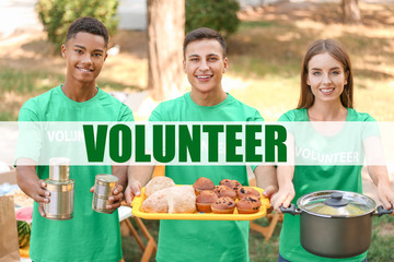 Wall Mural - Young volunteers with food for poor people outdoors