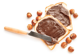 Fresh bread with chocolate paste on white background