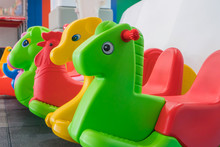 Kids Colorful Horse Rocking Chair On Indoor Playground For The Kid's Zone