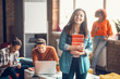 © zinkevych - Dark-haired student smiling while enjoying her day with friends studying