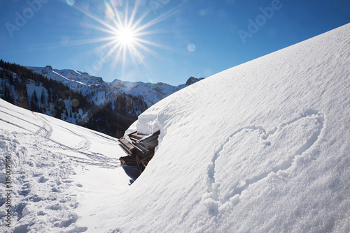 bright sunny winter landscape tirol, snow covered alp hut and love heart Poster Mural XXL