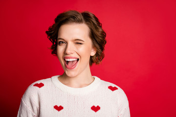 Poster - Close-up portrait of her she nice attractive pretty cute glad positive cheerful cheery girl winking flirting isolated over bright vivid shine vibrant red color background