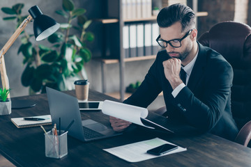 Sticker - Profile photo of confident business guy thoughtful read paper report hold hand on chin important documents wear specs black blazer shirt tie suit sitting chair office indoors