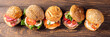 Assorted sandwiches on wooden background. Healthy food concept with copy space. Top view. Banner.