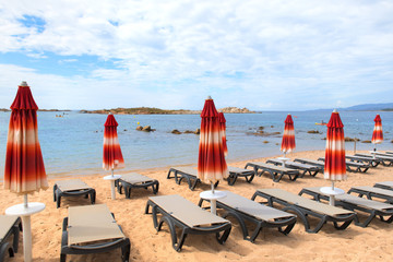 Canvas Print - Beach with relax beds at Corsican coast