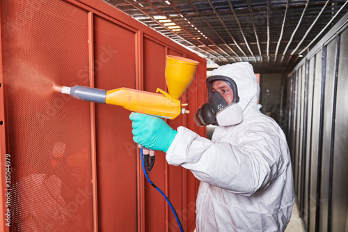 Fotomural polymer coating of metal detail with powder spraying gun