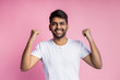 © liliyabatyrova - Portrait of handsome Indian guy standing on pink background