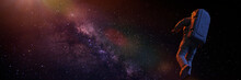 Astronaut Flying Towards The Beautiful Milky Way Galaxy