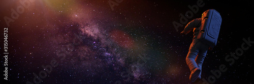 astronaut flying towards the beautiful Milky Way galaxy