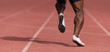 © pavel1964 - African-american male sportsman running on stadium track, dynamic run of sprinter in a stadium