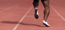 African-american Male Sportsman Running On Stadium Track, Dynamic Run Of Sprinter In A Stadium