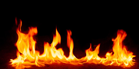 Fire flames and Smoke on black background. Image of blaze fire flame texture and burning fire for decorative special effect .