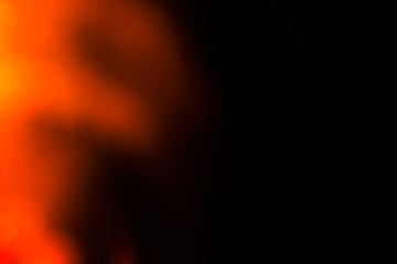 Poster - orange flare on a black background. beautiful light for design