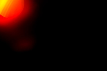 Poster - orange flare on a black background. beautiful light for design