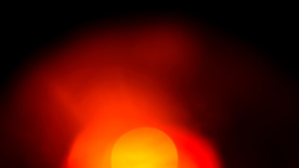 Poster - orange flare on a black background. beautiful light for design