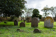A Rural Graveyard With A Mixture Of Different Shaped Grave Stones