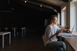 © Drobot Dean - Photo of smiling caucasian woman using mobile phone and laptop