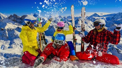 Leinwandbilder - Happy family enjoying winter vacations in mountains . Ski, Sun, Snow and fun.