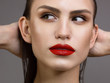 © evgeniyasht19 - Close-up beauty portrait of the face of a beautiful woman with dark black smoky eye makeup, natural full lips and extremely long eyelashes. Model with wet long curly hair. eyeliner and thick eyebrows