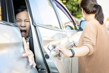 Accident,hand Slammed The Door,mischievous Child Girl Was Pinched Her Hand Or Fingers In The Car Door,asian Daughter Shouted In Pain,woman Or Mother Closed The Car Door Without Careful,inadvertently