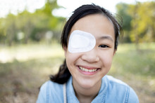Happy Asian Child Girl Cover With Blindfolded Bandaged Eye After Surgery Or Treatment Of Strabismus,lazy Eye, Hygienic,prevent Infection,protect Dust,smiling Female People Feeling Pain,eye Injury