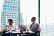 © Shutter B - Corporate business team meeting discussion and startup concept. Successful businesspeople discussing together in conference room during meeting at modern business lounge high up in an office tower.