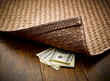 © Andy Roberts/Caia Image - Money hidden under rug