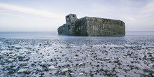 Ruins In Ocean At Low Tide And Rocks On Beach, Vigsoe, Denmark