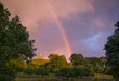 © Tom Merton/Caia Image - Tranquil rainbow over rural countryside park