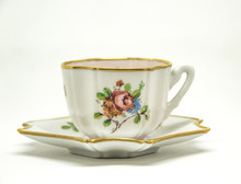 Ceramic Tea Cup With Floral Paintings On A White Background