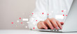 © chinnarach - close up on man hand typing on  laptop  to working about futuristic of social media marketing icon for internet network technology and business concept