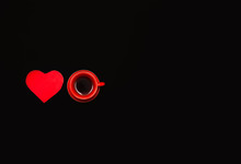 Red Cup Of Coffee On A Black Background Minimalism With Heart. Breakfast Tea For Valentine's Day, Mother's Day