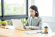 © Have a nice day  - Communication support, contact us, Young friendly Asian Thai girl operator woman customer service agent with phone  VOIP headsets working in a call center modern office