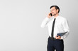 © Pixel-Shot - Male real estate agent talking by mobile phone on light background