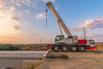 Wall Mural - Crane trucks in the construction of a bridge