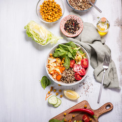 Wall Mural - Quinoa salad with chickpeas, spinach, tomatoes, healthy vegan lunch, diet and clean eating concept