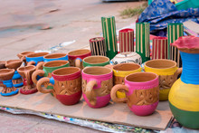 Indian Traditional Handmade Clay Potsisolated On Blurred Background Are Displayed In A Street Shop For Sale. Indian Handicraft And Art
