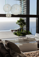 Sofas And Tables In Modern Living Room Overlooking Ocean