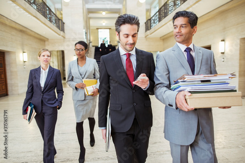 Obraz na plátně Lawyers walking in courthouse