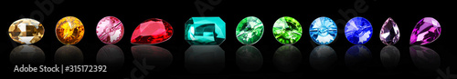 Fotomural Different precious stones for jewellery on dark background