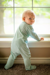 Beautiful baby girl wearing footie pajamas