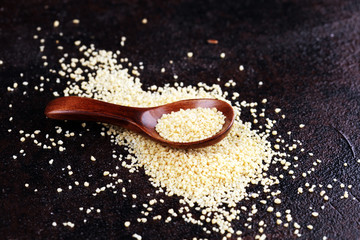 Wall Mural - Couscous in a wooden spoon. healthy food