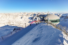 View From Pitztal Glacier Into The High Alpine Mountain Landscape With Cable Car Station And Ski Slope In Winter With Lots Of Snow And Ice, Austrian Alps In Tirol Austria