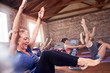 © Trevor Adeline/Caia Image - Mature woman doing core exercise in exercise class gym studio
