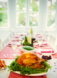 © Robert Daly/Caia Image - Christmas dinner turkey and white wine on dining table