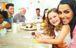 © Robert Daly/Caia Image - Portrait smiling mother and daughter hugging at birthday party table