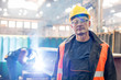 © Agnieszka Olek/Caia Image - Portrait confident steel worker in factory