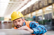 © Rafal Rodzoch/Caia Image - Serious steel worker examining steel in factory